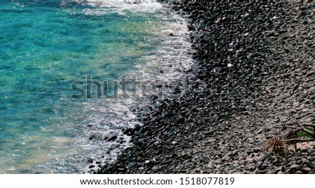 Surf washing onto shore rocks.