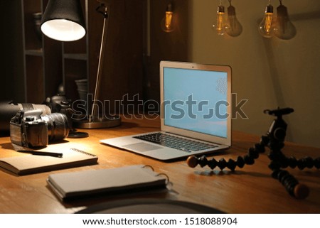 Workplace of photographer late in evening