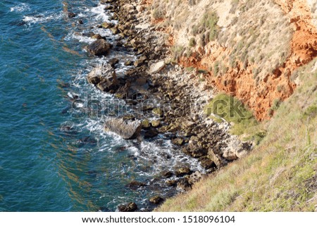 Panoramic sea view from a sandy mountain cliff, Cape Kaliakra Bulgaria, sea horizon, bright sunny seascape, blue sky and turquoise wave, ocean landscape, marine background