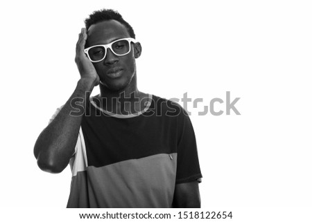 Studio shot of young African man in black and white