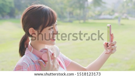 young asian woman take selfie with her smart phone