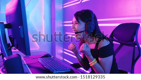 Young Asian Pretty Pro Gamer win in Online Video Game Royalty-Free Stock Photo #1518129335