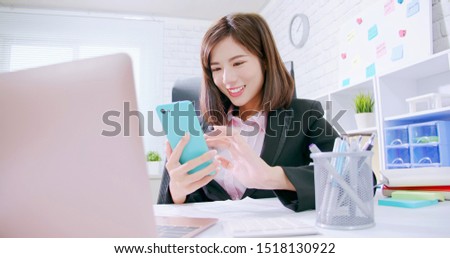 asian business woman use smart phone in the office