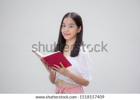 asia thai teen White t-shirt beautiful girl read a book