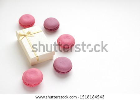 French Pink Macaroons on White Background. Top View Traditional Dessert for Feminine Design. Confectionery, Fashion, Beauty Advertising Template