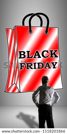 Businessman watching a black friday concept drawn on a wall