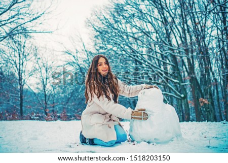 Winter concept. Global cooling. People in snow. Woman winter portrait. women on mountain. Winter portrait of young woman in the winter snowy scenery