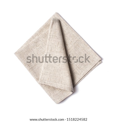 Top view of single folded light gray linen serviette isolated on white background Royalty-Free Stock Photo #1518224582