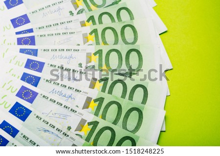 Background made of scattered euro bills 100 hundred banknotes. Money, business, finance, saving, banking concept. Exchange Rates. Frame, copy space, top view.