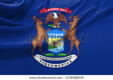 Realistic flag State of Michigan on the wavy surface of fabric