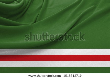 Realistic flag of Chechen Republic of Ichkeria on the wavy surface of fabric
