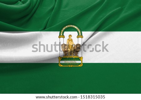 Realistic flag of Andalusia on the wavy surface of fabric