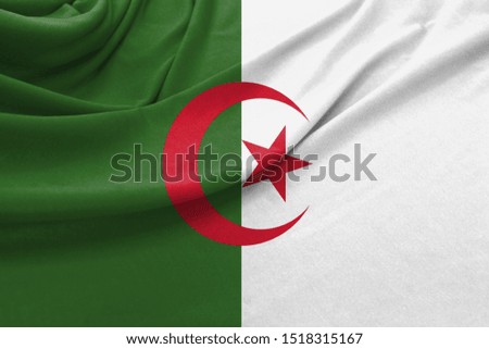 Realistic flag of Algeria on the wavy surface of fabric