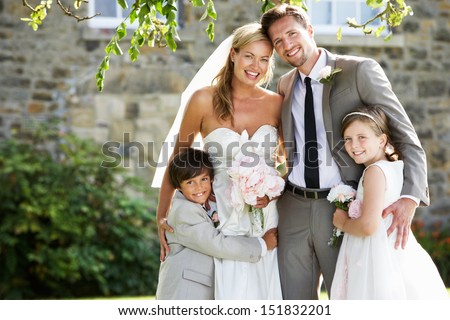 Bride And Groom With Bridesmaid And Page Boy At Wedding Royalty-Free Stock Photo #151832201