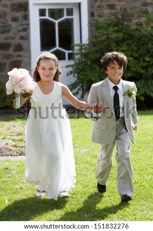 Portrait Of Bridesmaid With Page Boy Royalty-Free Stock Photo #151832276