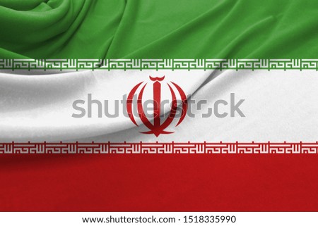 Realistic flag of Iran on the wavy surface of fabric