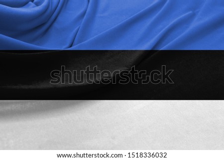 Realistic flag of Estonia on the wavy surface of fabric