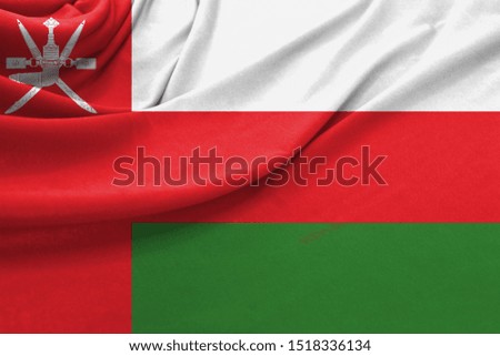 Realistic flag of Oman on the wavy surface of fabric