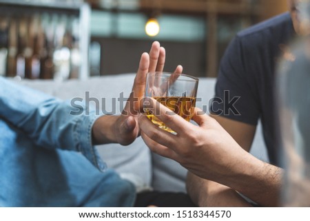 Stop alcohol concept. Person refuse to drink alcohol. Royalty-Free Stock Photo #1518344570