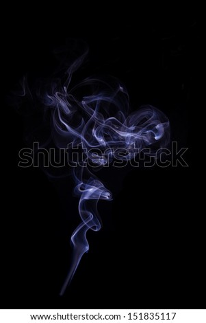 Beautiful purple smoke isolated on black background. Abstract artistic backdrop.