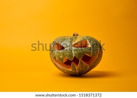 Picture of halloween pumpkin on empty orange background