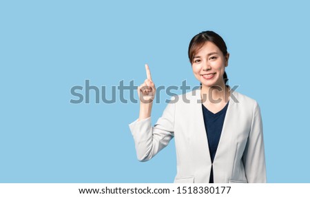 Introducing young asian woman. Announcement. Lecturer. Royalty-Free Stock Photo #1518380177