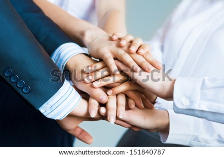 concept of teamwork. business people joined hands