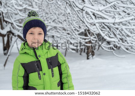 Portrait of cute boy in winter time