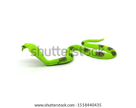 Closeup of cobra snake toy on white background.