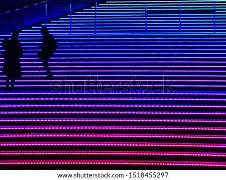 Rainbow staircase with young couple