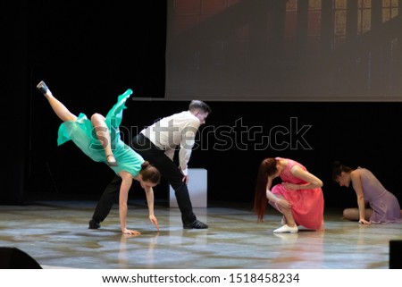 Dancers actors perform in the theater on stage in a dance show