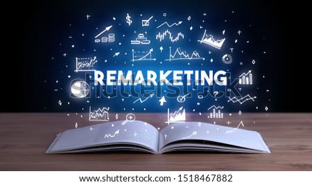 REMARKETING inscription coming out from an open book, business concept
