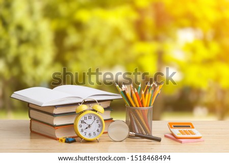 Education concept - books and school supplies on the desk
