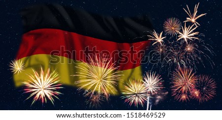 Holiday sky with fireworks and flag of Germany, independence day of country