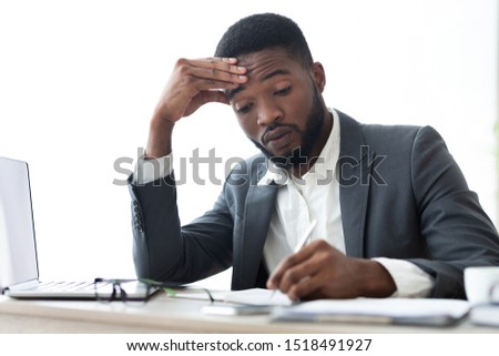 Busy businessman in formal suit signing contracts or agreements at workplace in modern office, copy space