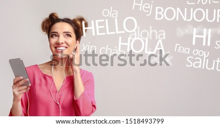 Woman with cellphone hearing different languages on grey background, panorama