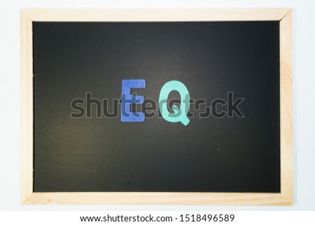 EQ Concept on blackboard wood frame