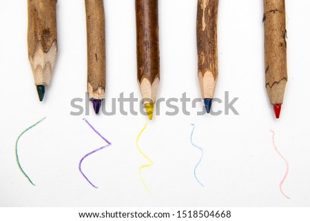 
Coolored pencils made of natural wood on a white background. Red, yellow, blue, purple, green. Drawing background for students at school.