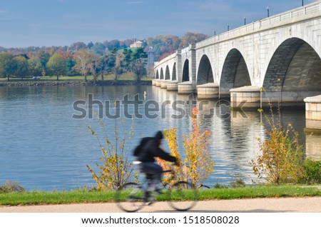 Washington DC in autumn - A cyclist in motion blur and Memorial Bridge