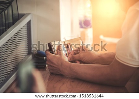 A man taking a credit card from his wallet to make a purchase