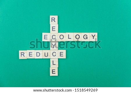 Ecology and green planet minimalistic concept. Isolated wooden letter blocks with word cloud Ecology and recycle, reuse, reduce principle