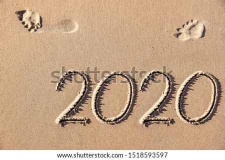 drawing image in the sand of the coming new year