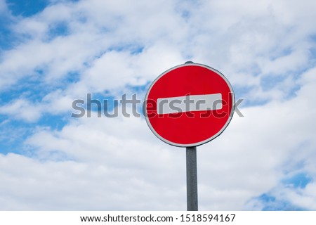 International traffic sign 'No Entry' or 'No Entrance'. Blue sky with clouds are on background