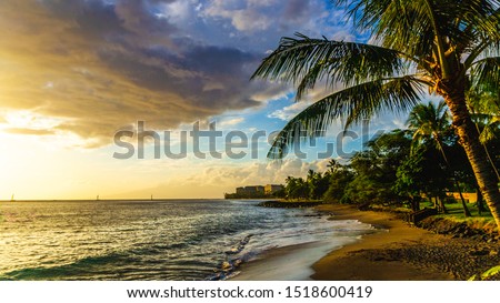 Hawaii Sunset in Maui  on the beach as the sun is setting