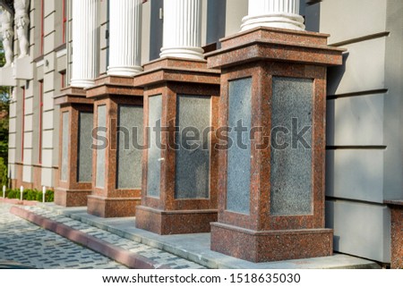Detail of a house facade. Granite columns as decorative elements of the building.