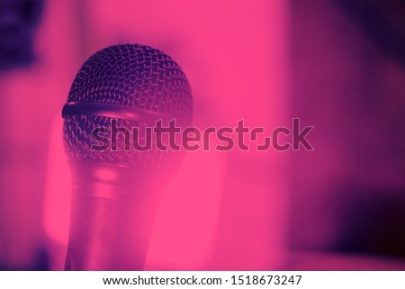 microphone for vocals in a retro style on blurry pink background
