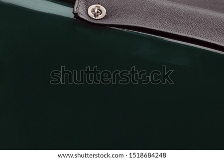 Close up of vintage classic green car, tonneau and fastener