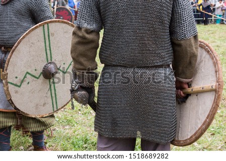 Reconstructors dressed in riveted chain mail Royalty-Free Stock Photo #1518689282
