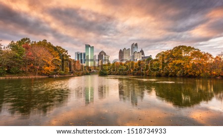 Atlanta, Georgia, USA Piedmont Park skyline in autumn on Lake Meer at dusk.