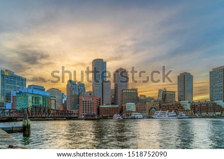 Boston skyline from Fan Pier at the fantastic twilight time with smooth water river, Massachusetts, USA downtown skyscrapers, United states of Amercia, Architecture and building with tourist concept Royalty-Free Stock Photo #1518752090